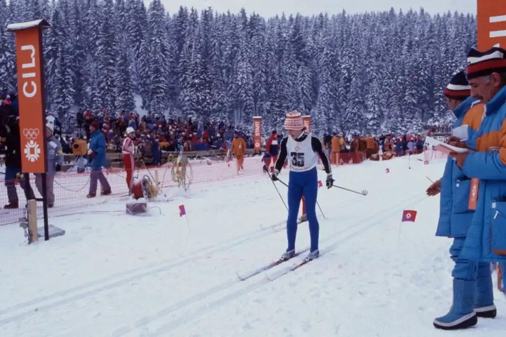 A cross-country skier crosses the finish line at Veliko Polje, 1984