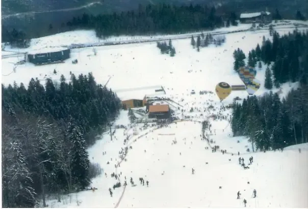 Hot air balloons hover over the Bjelašnica downhill finish area, 1984