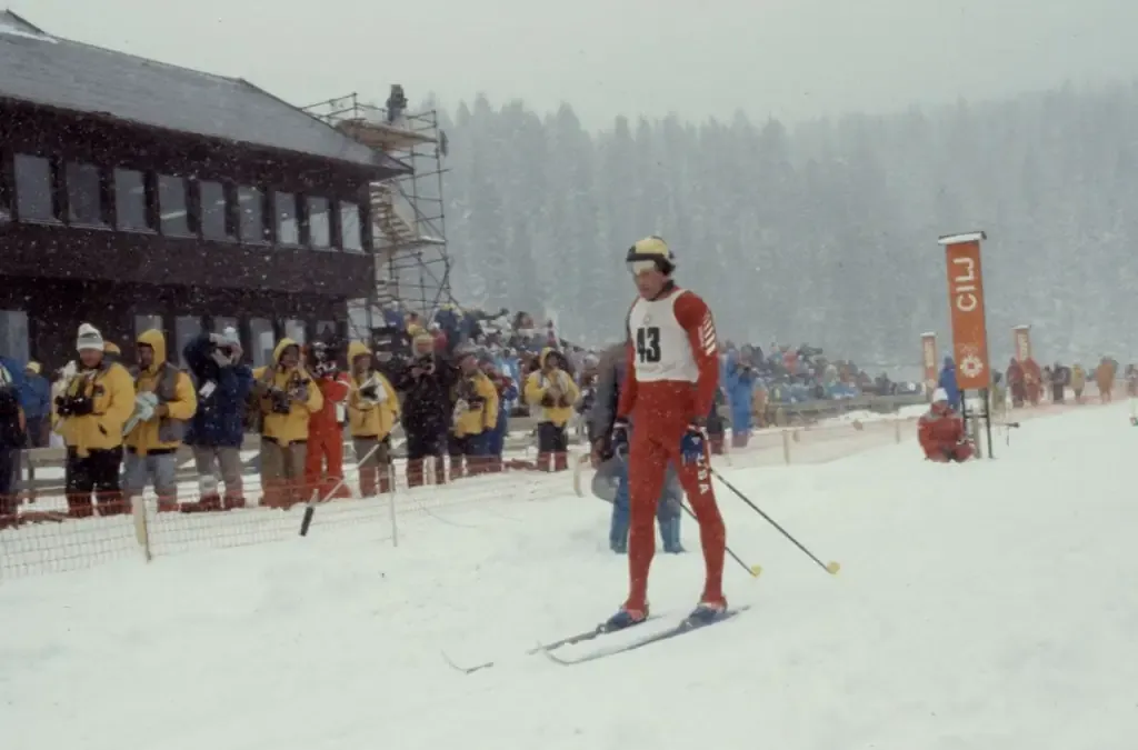 A cross-country skier reaches the finish line at Veliko Polje, 1984