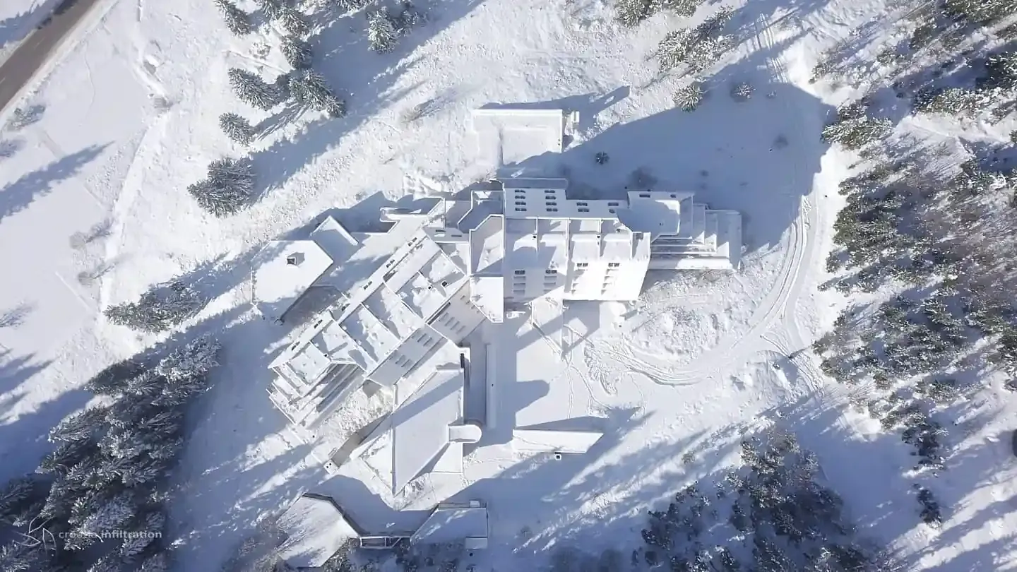 The snow-covered ruins of Hotel Igman seen from above in 2020