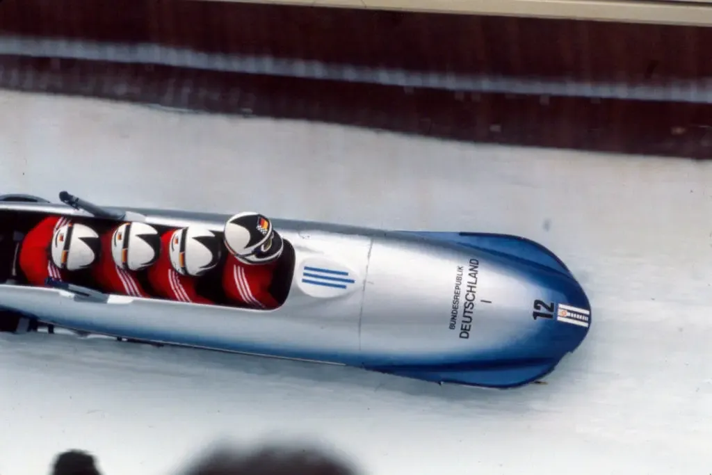 West German bobsled team competing at the 1984 Winter Olympics