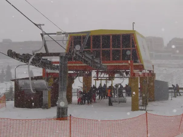 Skiers gather at the Bjelašnica three-seater chairlift base station, 2009