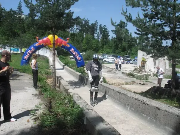 An inline skater navigates the Trebević Olympic bobsled track, 2008