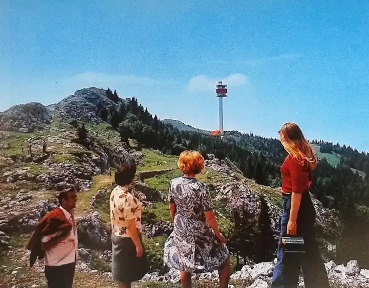 Sightseers on Mount Trebević overlooking the communication tower