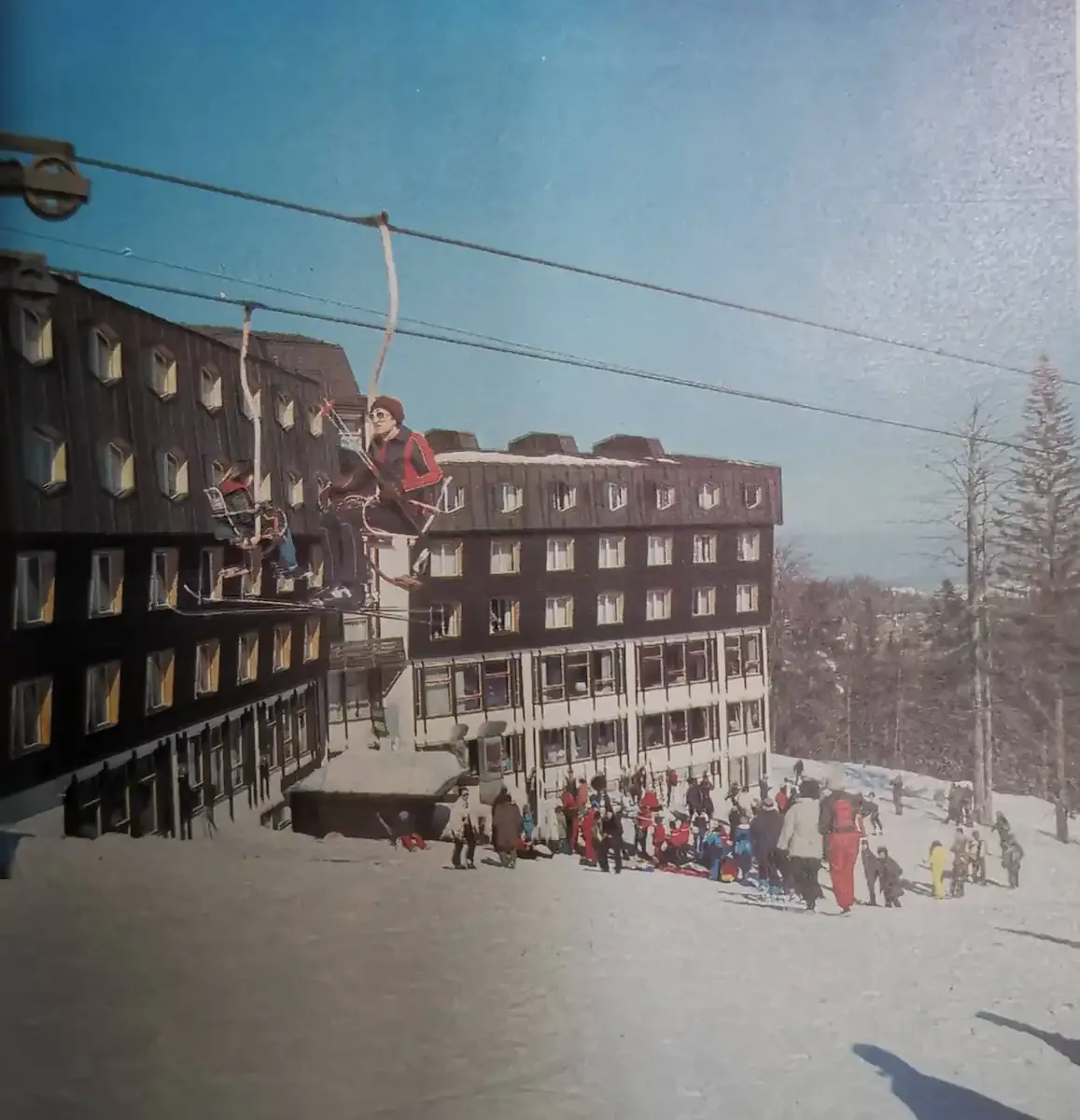 A chairlift passes the Hotel Jahorina during the 1980s