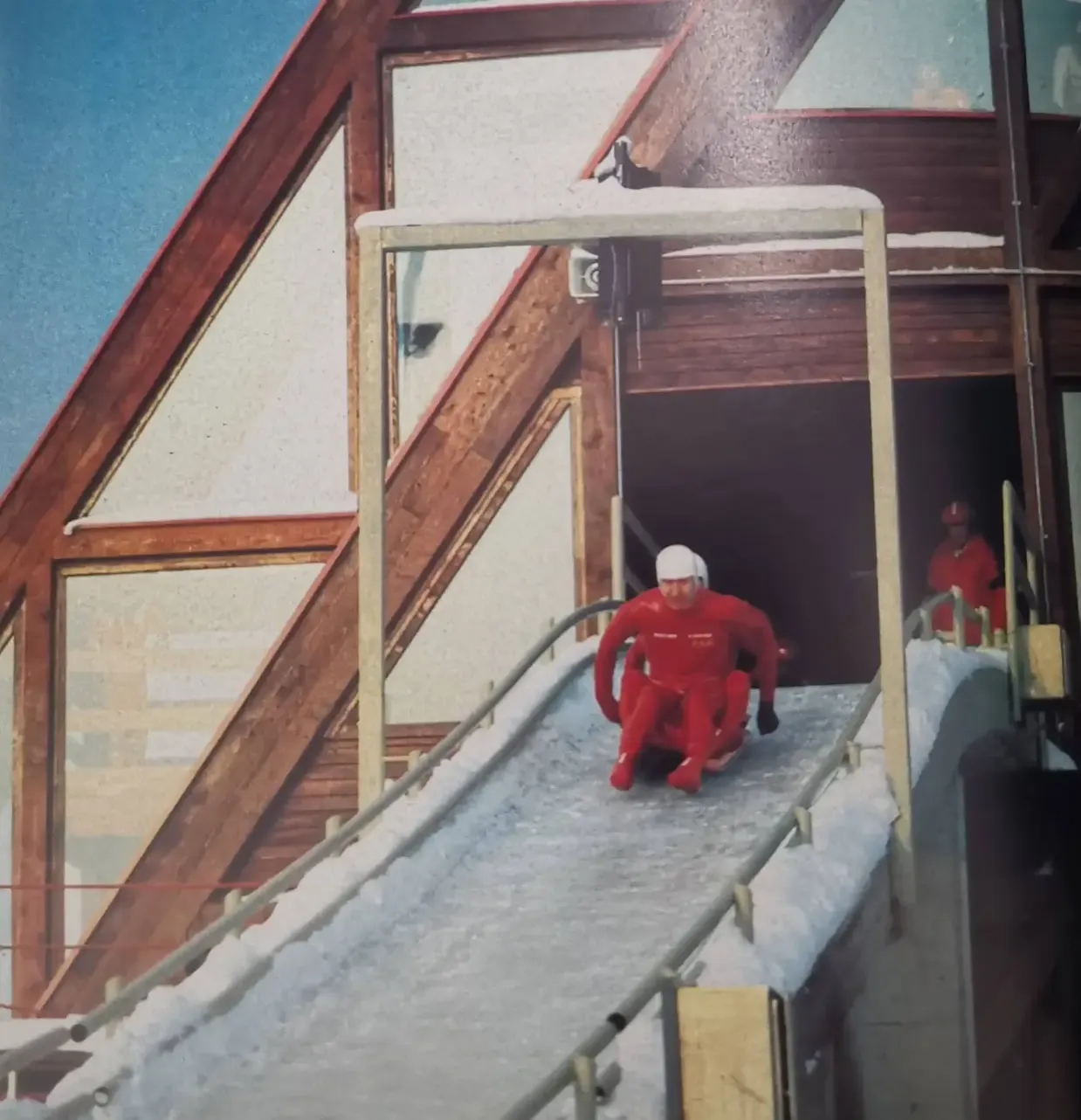 Men's luge competitors exit the start house at Trebević in 1984