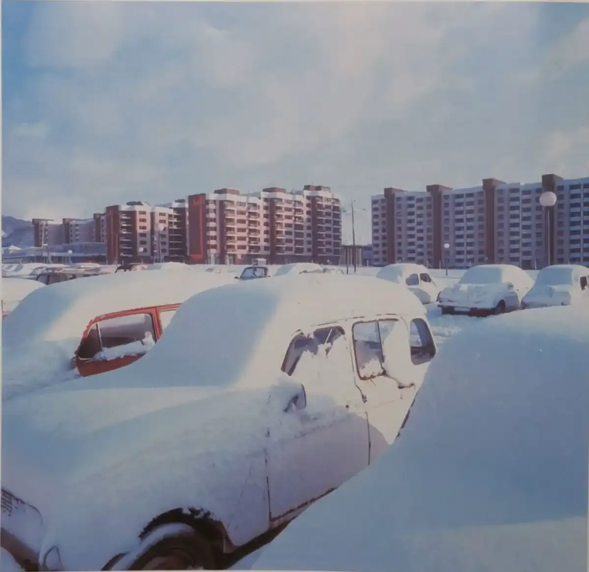 Snow-covered cars at the Mojmilo Olympic Village in the 1980s